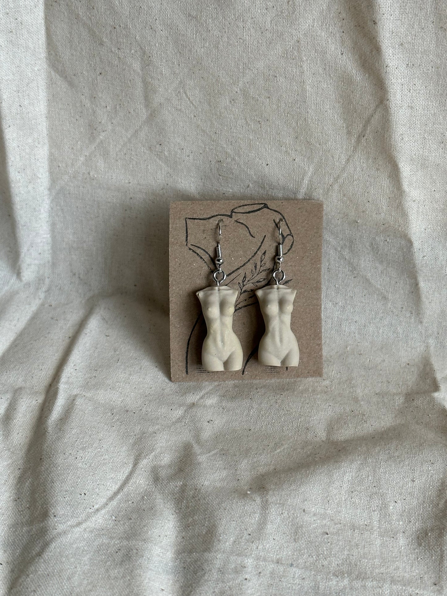 Slim female body earrings in beige - silver hooks