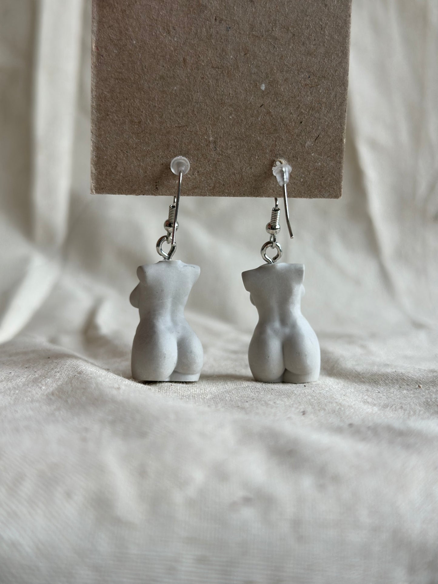 Plus size female body earrings in light grey - silver hooks