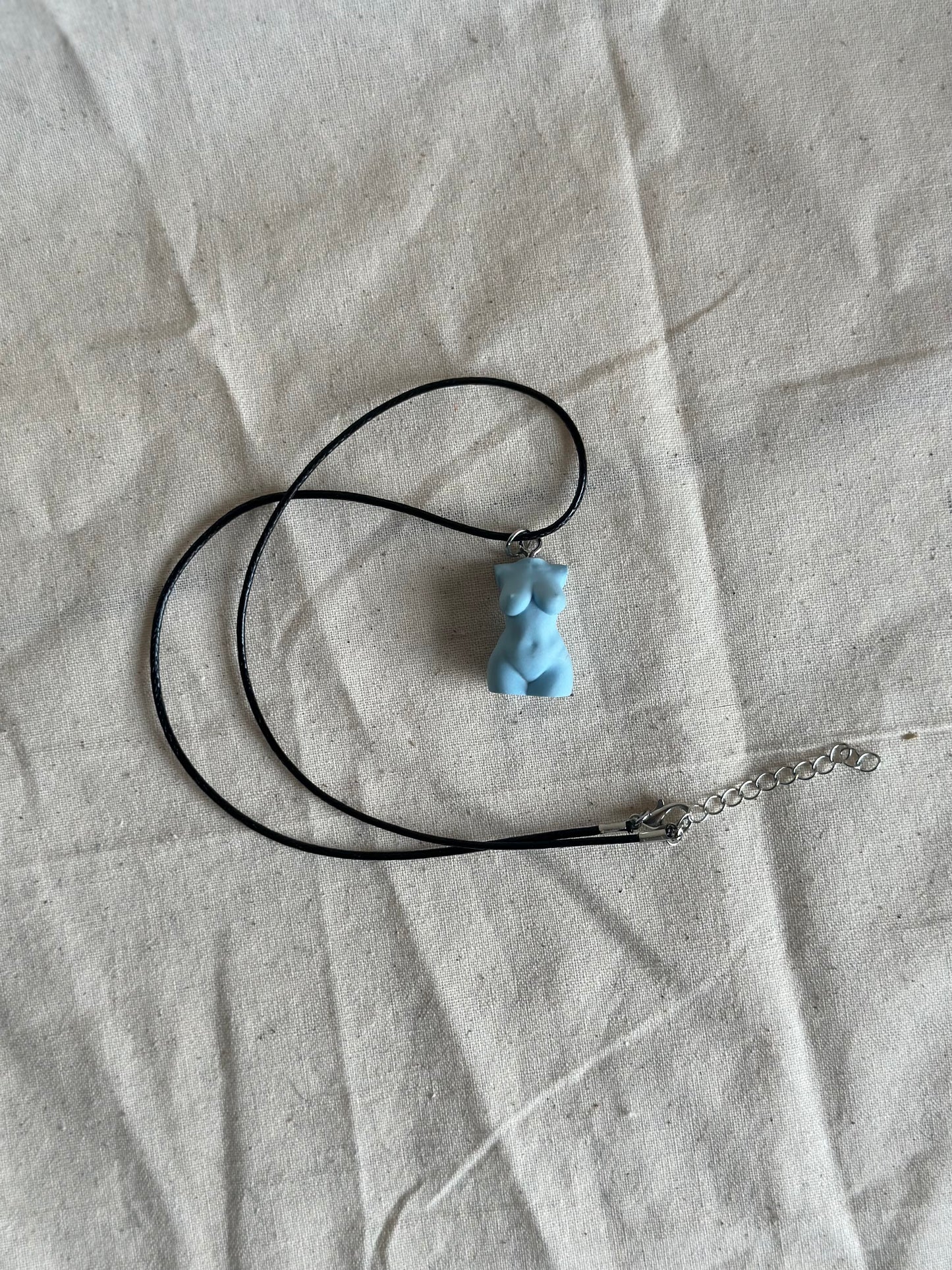 Plus size female body necklace in light blue - black cord