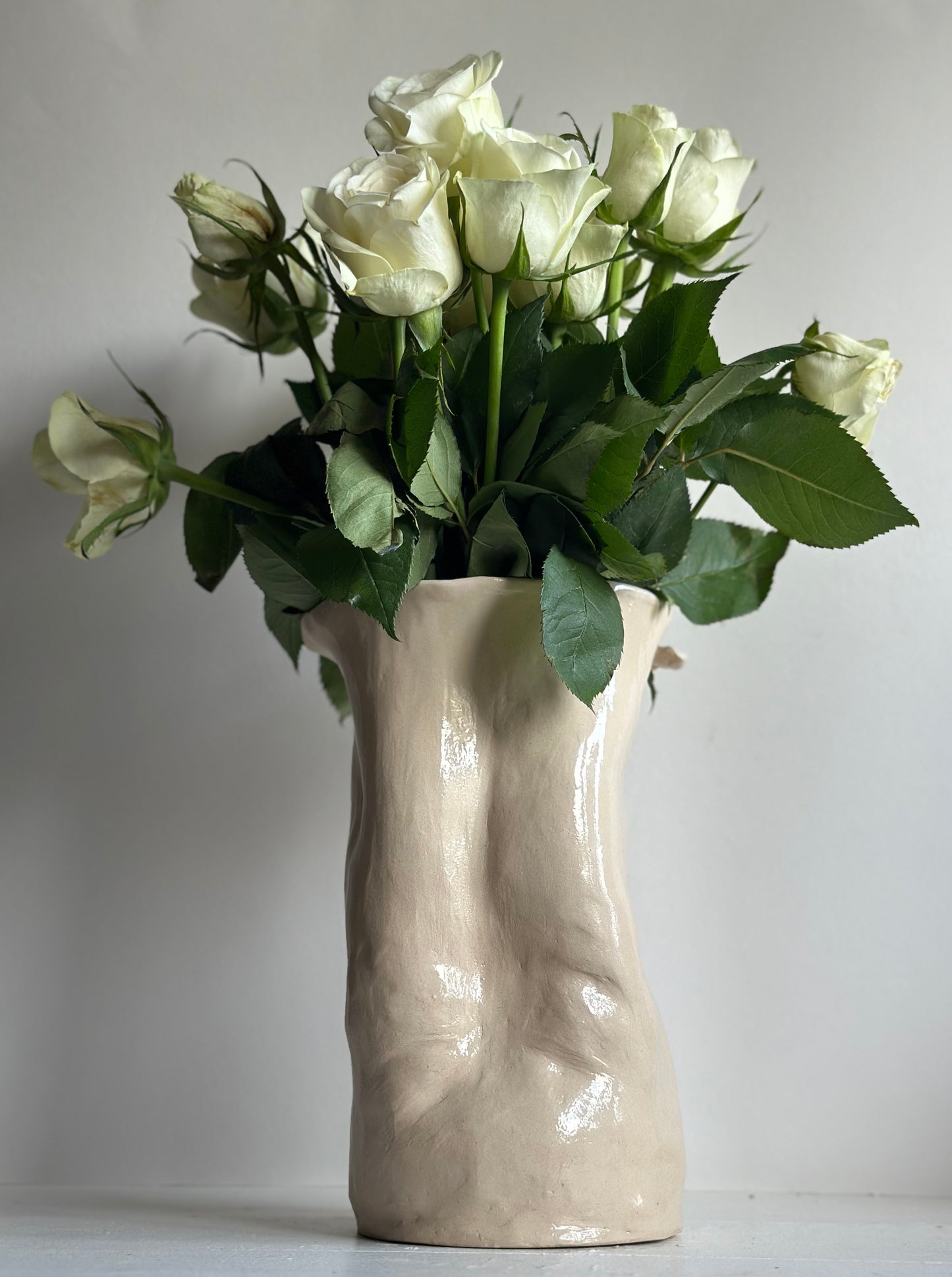 Ceramic belly sculpture vase