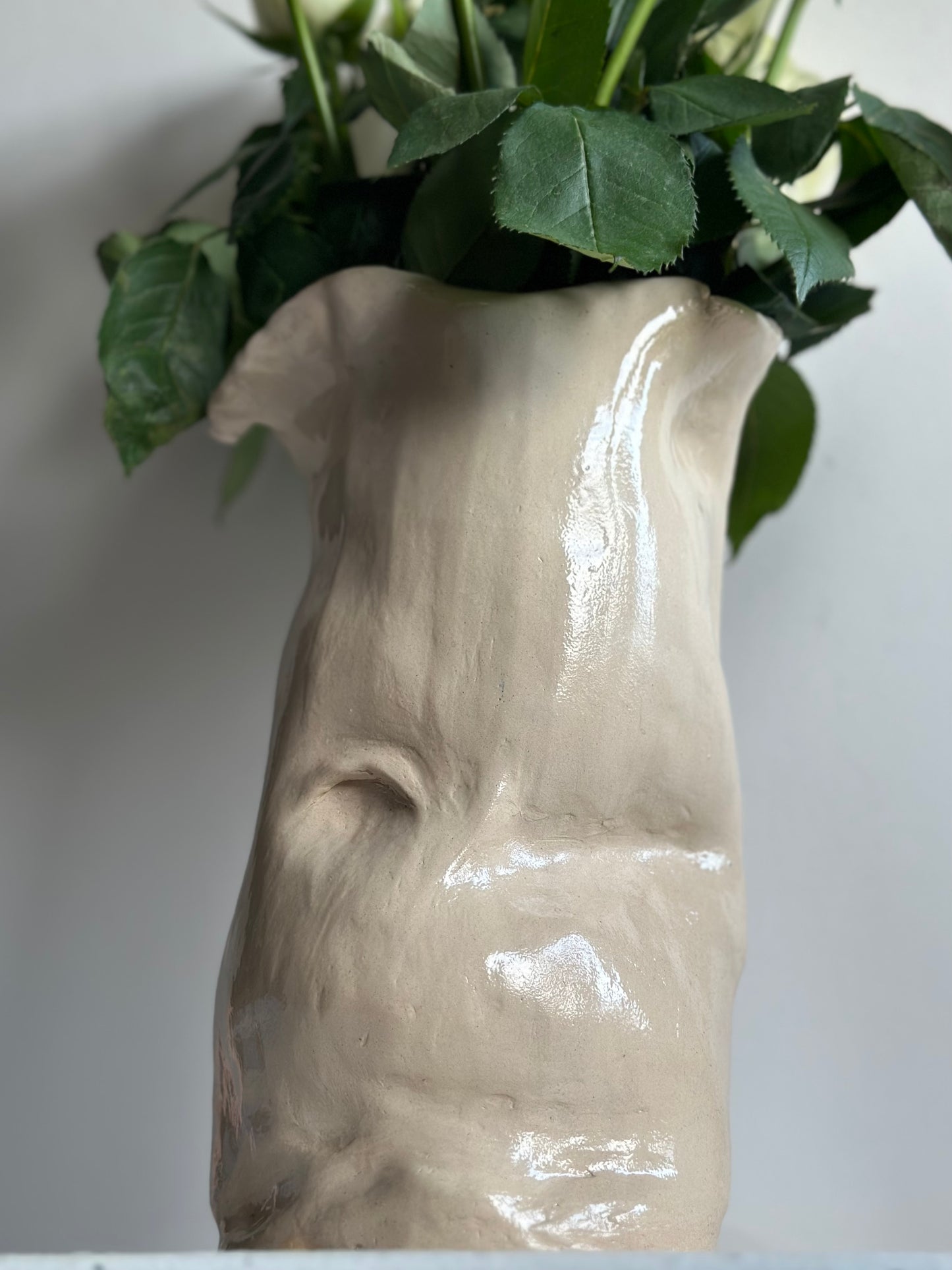 Ceramic belly sculpture vase