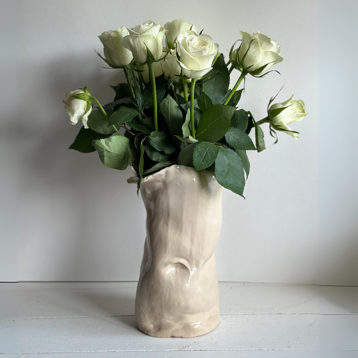 Ceramic belly sculpture vase